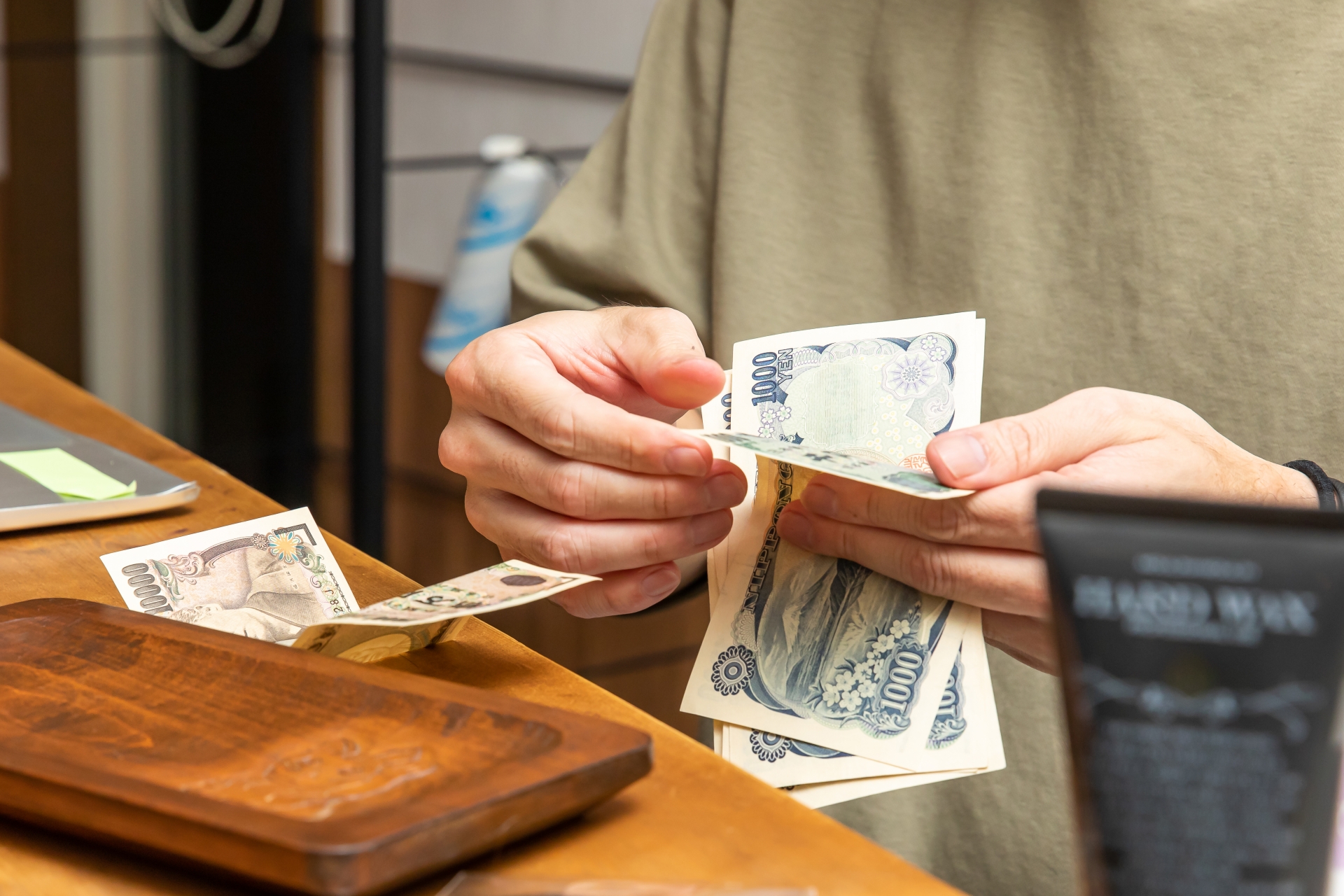 Cash transaction at convenience store in Japan