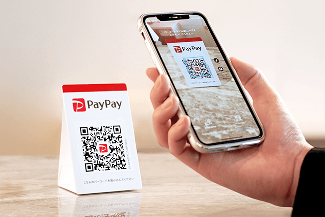 User scanning QR code using PayPay or LINE Pay
